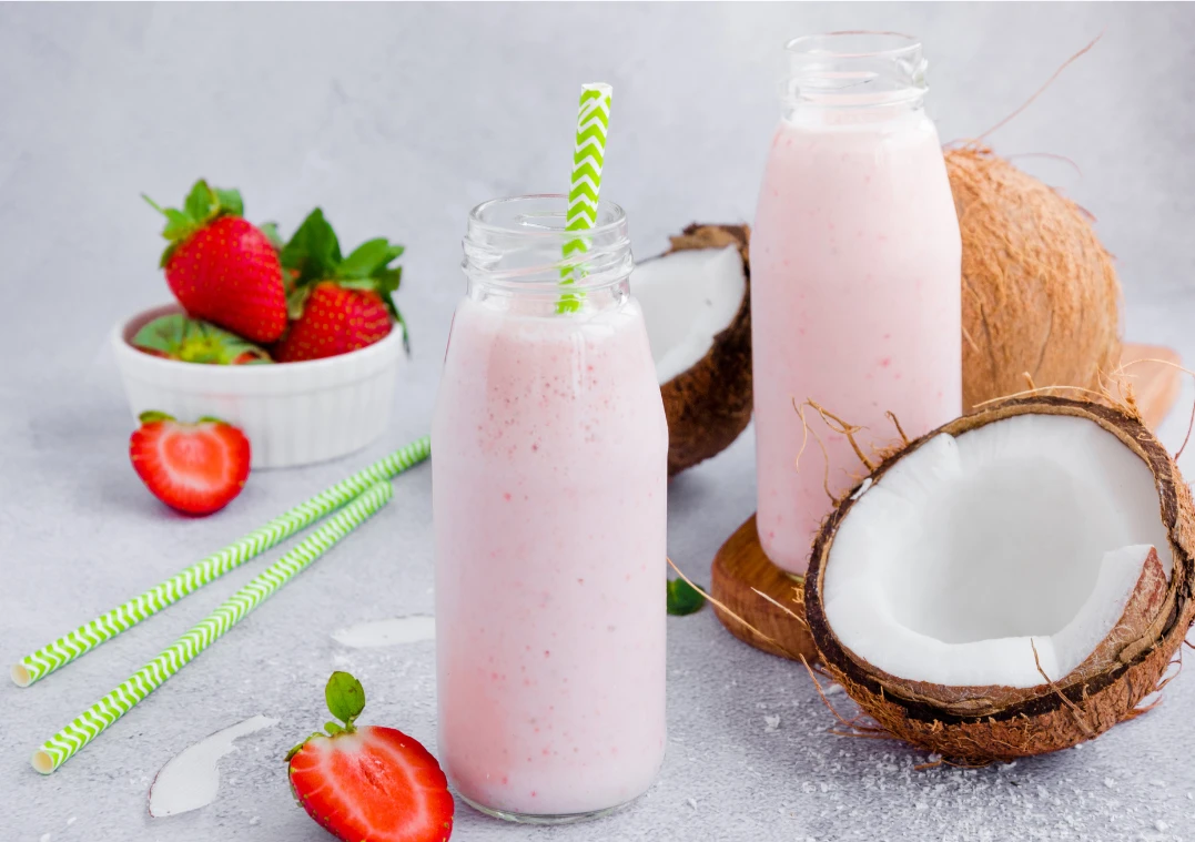 Strawberry coconut dream smoothie topped with shredded coconut.